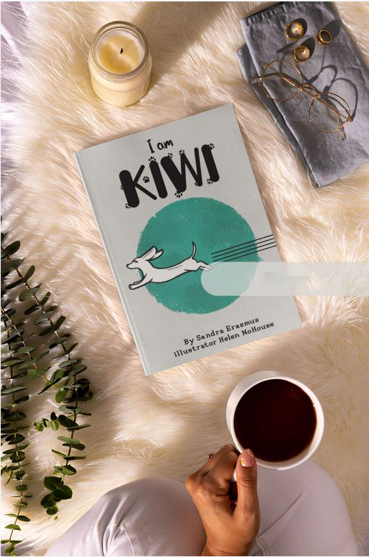 I Am Kiwi book displayed on a soft background with tea and stationery